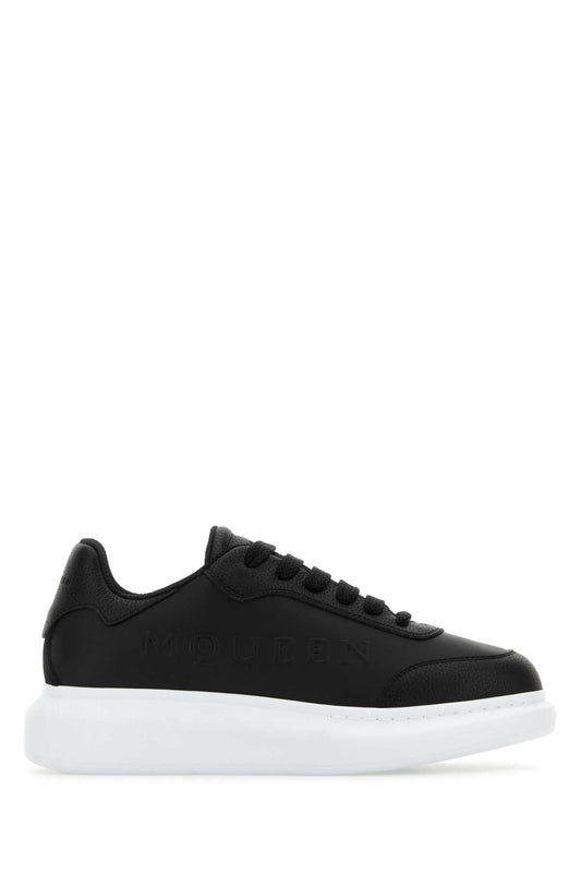 Alexander Mcqueen アレクサンダーマックイーンブラックレザースニーカー、黒い革のヒール - Image 1