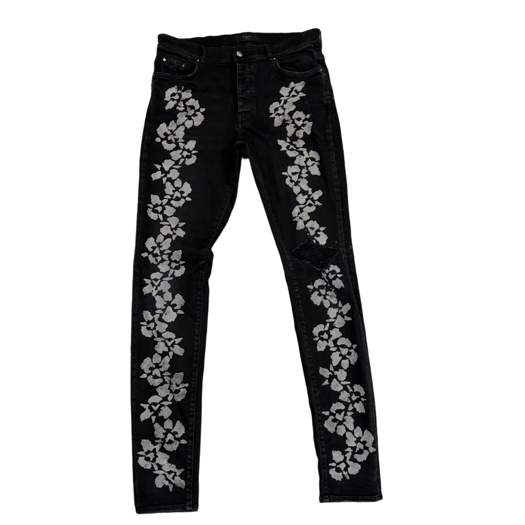 AMIRI 'BLACK' HIBISCUS FLOWER STENCIL JEANS