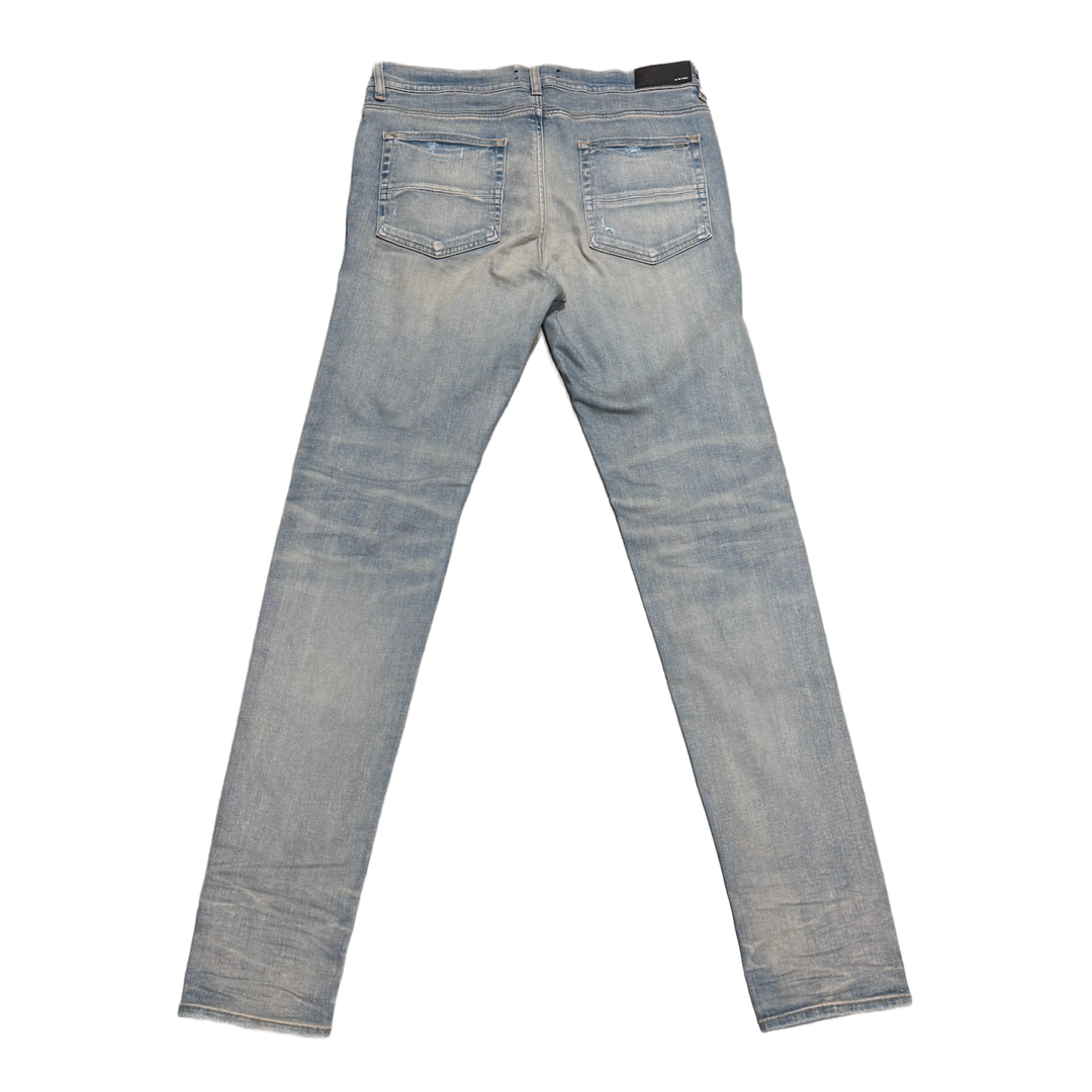 AMIRI 'TIE DYE PATCH' DISTRESSED JEANS
