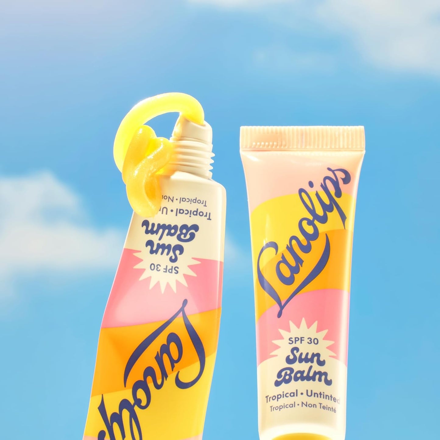 Lanolips Sun Balm Tropical SPF 30 - Hidratante labial de lanolina hidratante con aroma a piña, esenciales de playa y cuidado solar con protección UVA/UVB de amplio espectro, sin teñir (0.44 onzas)